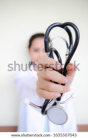 Female doctor show stethoscopy