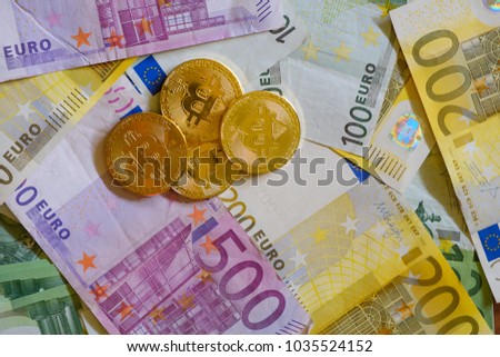 Gold Bitcoins, Crypto currency and Euro banknotes, virtual money