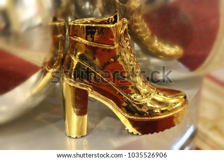 Women's high heel shoes in gold color