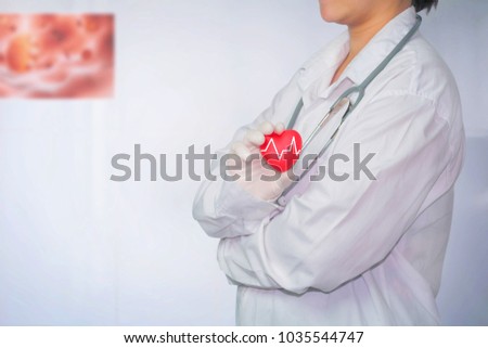 Health care system. Hand holding red heart cardiography and white room background. copy space. Hospital.  