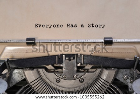 Everyone Has a Story text typed words on a old vintage typewriter. close up