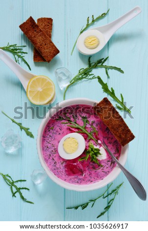 Summer cold soup with beets, eggs and greens. Beet soup. Lunch on a hot day.
