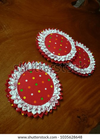 Beautiful  red Coaster flowers.Made of fabric in the form of flowers.