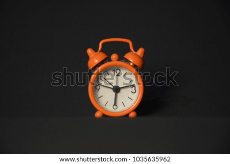 Alarm clock with plan black background
