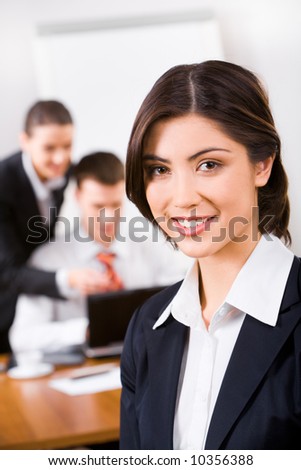 Photo of pretty confident specialist in suit in the office