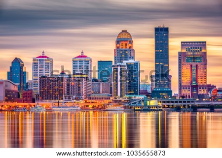Louisville, Kentucky, USA downtown skyline on the Ohio River at dusk.  Royalty-Free Stock Photo #1035655873