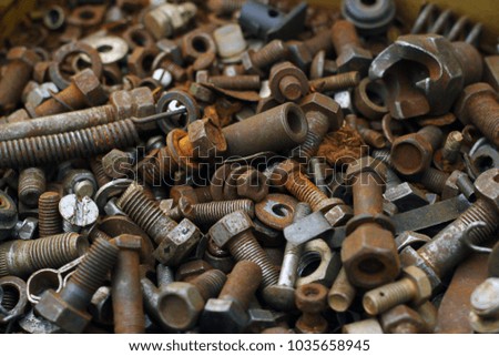 Old rusty screws, nuts and bolts background