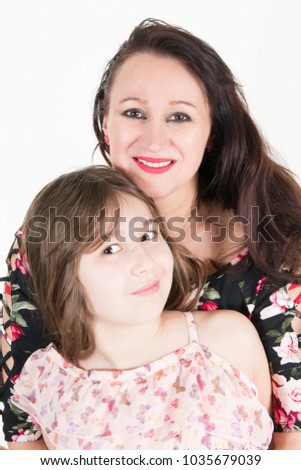 Happy young family with one child smiling at camera isolated on white