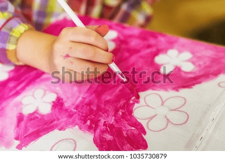 children's hands draw a house for dolls. child creativity Place for text