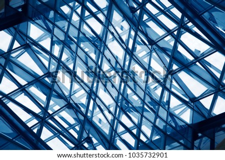 Double exposure photo of glass architecture. Modern office / public building with transparent walls, ceiling and roof.