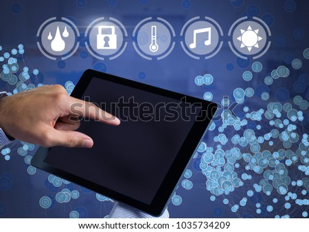 Digital composite of Hand holding tablet with smart home interface and connectors