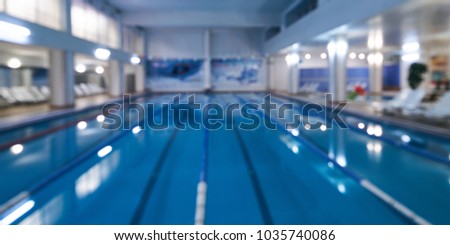 Indoor swimming pool in blur background. Abstract blurry swimming pool in fitness centre Royalty-Free Stock Photo #1035740086