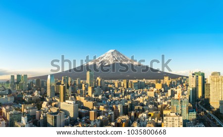 tokyo city with mount fuji on background with buildings and blue sky at twilight. dicut picture. copy space for text.
