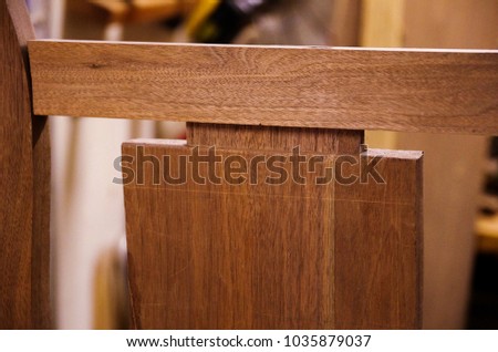 Hand cut mortise and tenon joint fitting together Royalty-Free Stock Photo #1035879037