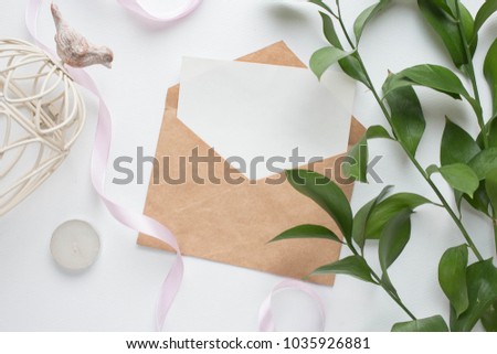 mockup card with plants. invitation card with environment and details Mockup with postcard and flowers on white background. card and pink flowers. ink pen, ink, stamp pink flowers with copy space