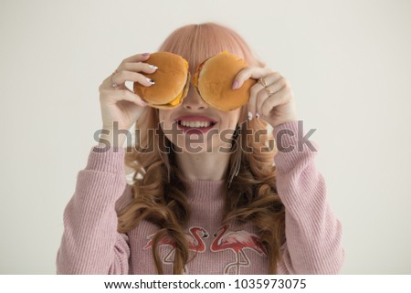 beautiful girl with two hamburgers, bad food, obesity, free place