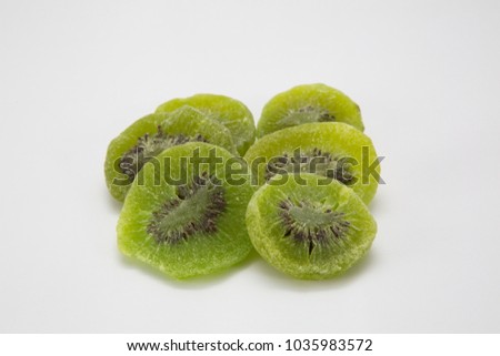 Dried kiwi berries on white background.