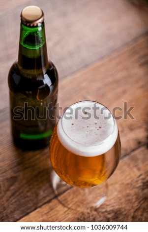 Bottle and glass with beer
