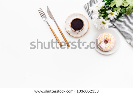 Sweet breakfast for a loved one. Coffee, dessert, flower on white table top view copy space