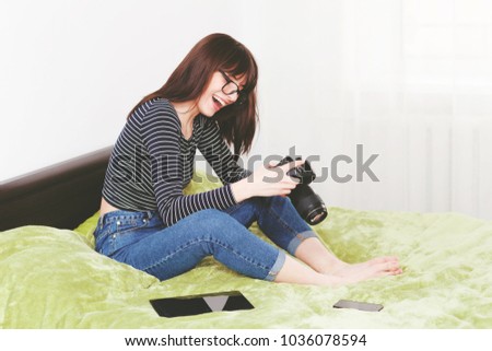A beautiful girl is preparing material for her blog.