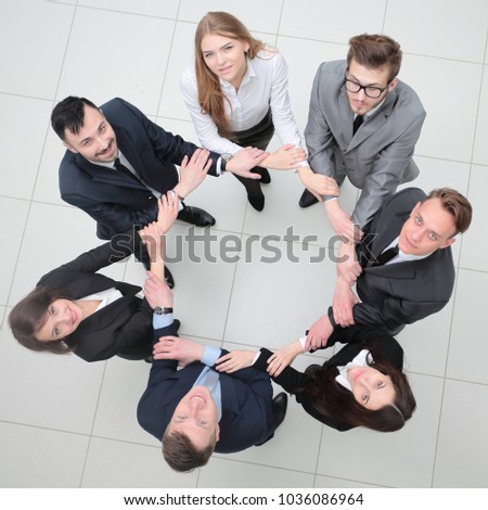 concept of partnership. business people standing in a circle.