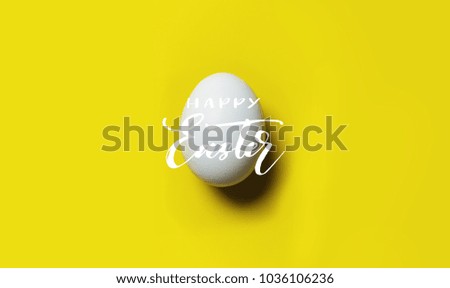 Easter egg on yellow background with Happy Easter sign. Easter card. Happy Easter concept.