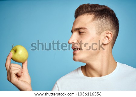 blue background, apple, man                             