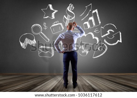 View of a Businessman in front of a wall thinking about a hand drawn business interface - business concept