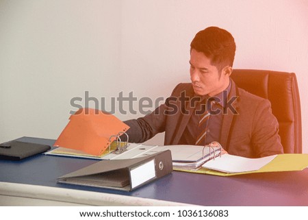 Business man sitting Ideally, planning and monitoring business desk.