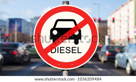 Street Sign diesel driving ban, cars on the street in the background Royalty-Free Stock Photo #1036209484