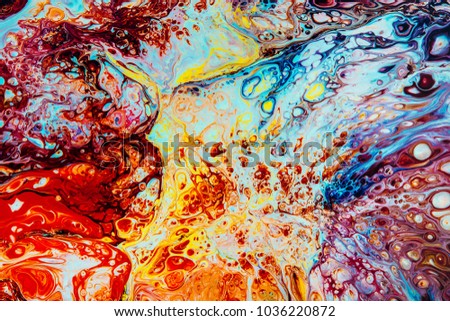 Artistic splashes of bright paints.