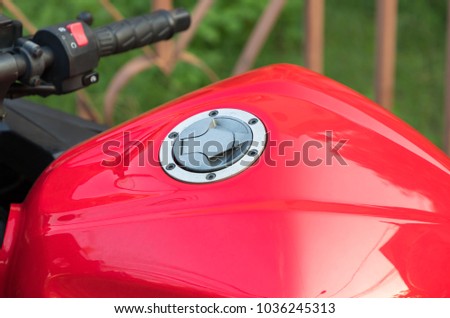 red motorcycle fuel tank background. Concept : travel by motorcycle or big bike.