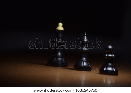 The queen, the elephant and the pawn stand on the table. Chess game.