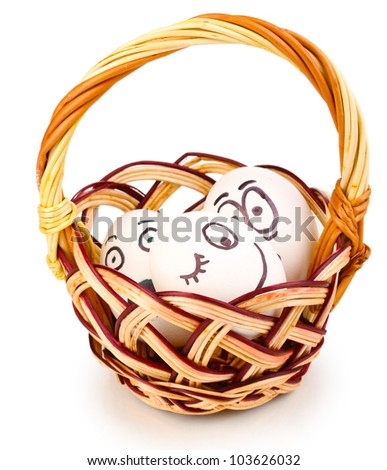 White eggs with funny faces in basket isolated on white