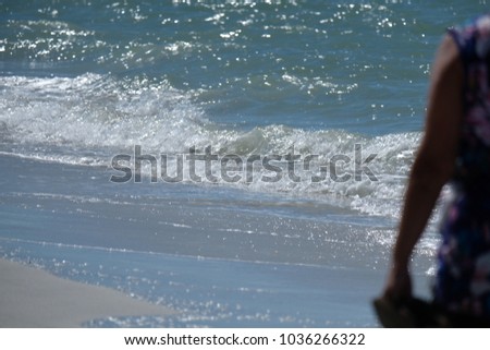 Blur People walk on the Beach 