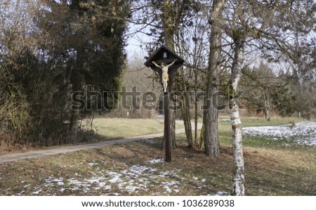 Waldstetten near Schwaebisch Gmuend, landscape with holy memorial, wood and stone cross with Jesus
