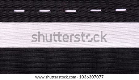 Black and white sewing elastic band isolated on white background. A variety of elastic bands for clothing and furniture. Royalty-Free Stock Photo #1036307077