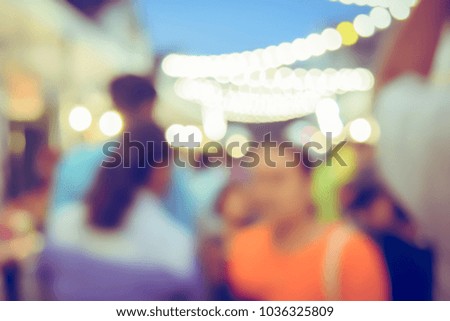 Vintage tone blurred defocused night of walking street festival in thailand bokeh background