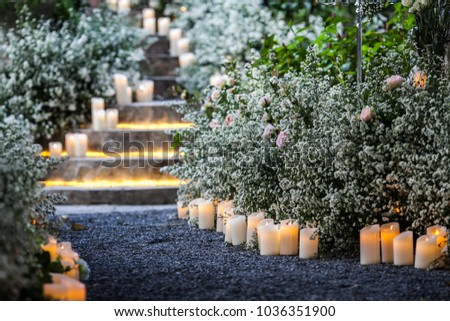 wedding decor, decorated stairs with sumps and lilac arrangements. Royalty-Free Stock Photo #1036351900