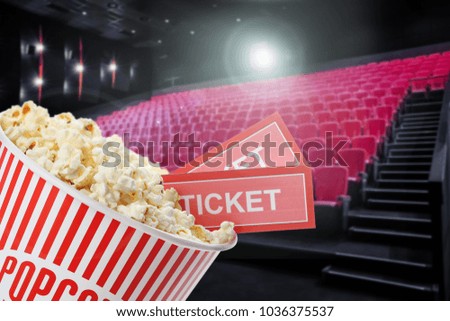 Tasty popcorn and tickets in cinema