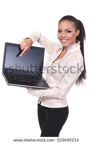 Attractive young girl with laptop smiling