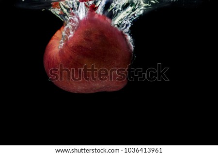 Red apple with water splash