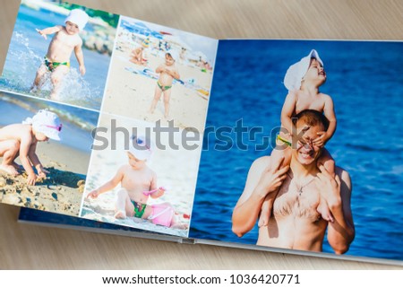 Photobook with beach photos isolated on white