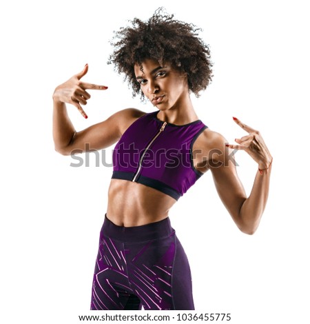 Sporty girl  showing gesturing with fingers rock and roll. Photo of cool funny african girl isolated on white background. Strength and motivation