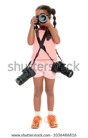 Small multiracial girl taking pictures with three professional cameras - Isolated on white