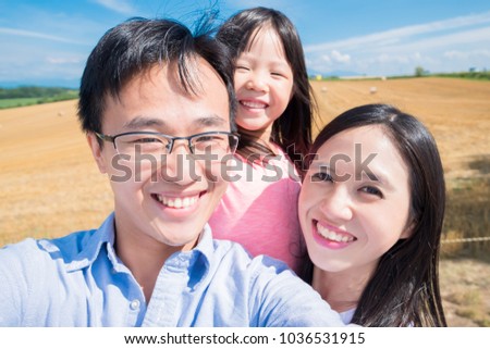 family smile and selfie happily in Hokkaido paddy