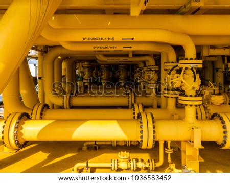 Offshore oil and Gas central processing platform and remote platform produced oil, natural gas and liquid condensate for set to onshore refinery from offshore in ocean sea background. Royalty-Free Stock Photo #1036583452