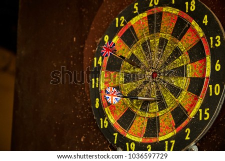 old dart board with dart arrow. focus on target business concept