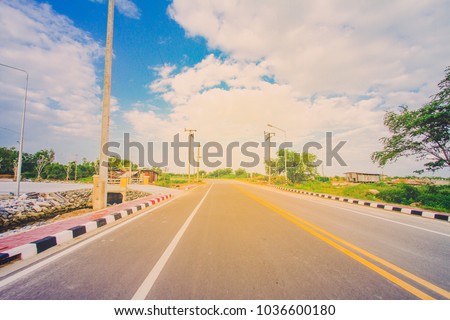 Straight road in nature. road over blue sky background.