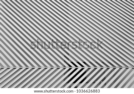 Seamless background of strong diagonal stripes on a modern metal fence 